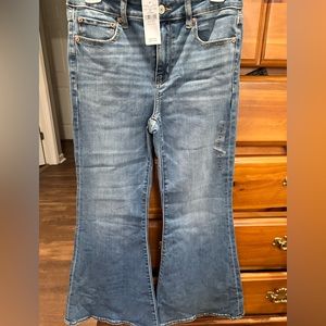 Brand new with tags!! American Eagle Next level stretch: Festive Flare jeans